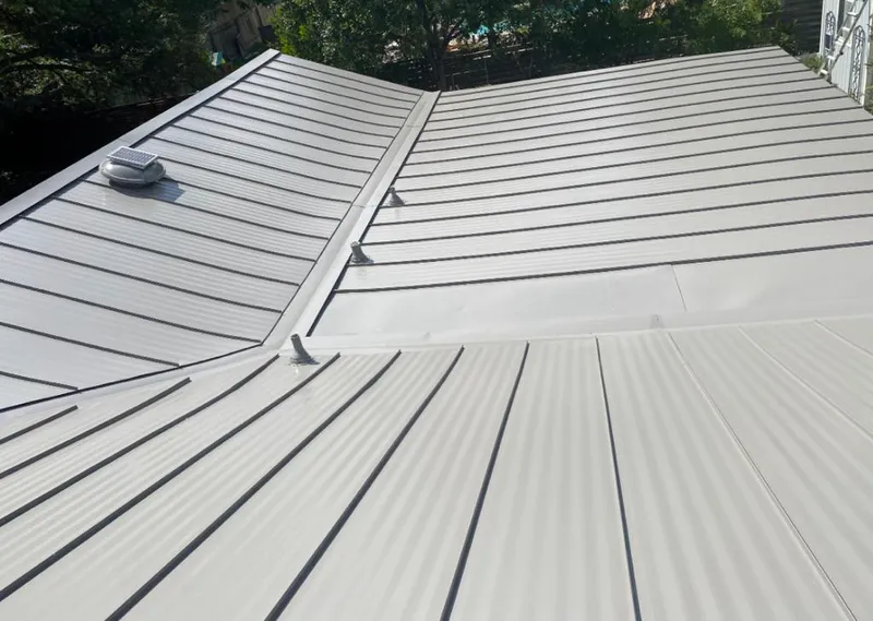 Solar attic fan installed on a metal roof for Roof Ventilation in Hillcrest